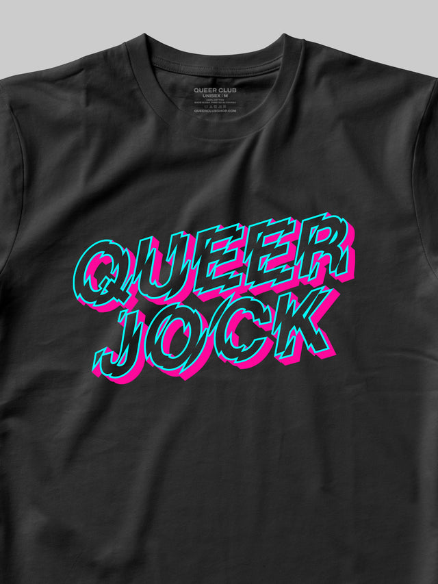 Detailed close up of the Queer Club brand black t-shirt with 'QUEER JOCK' text in pink and blue neon colours